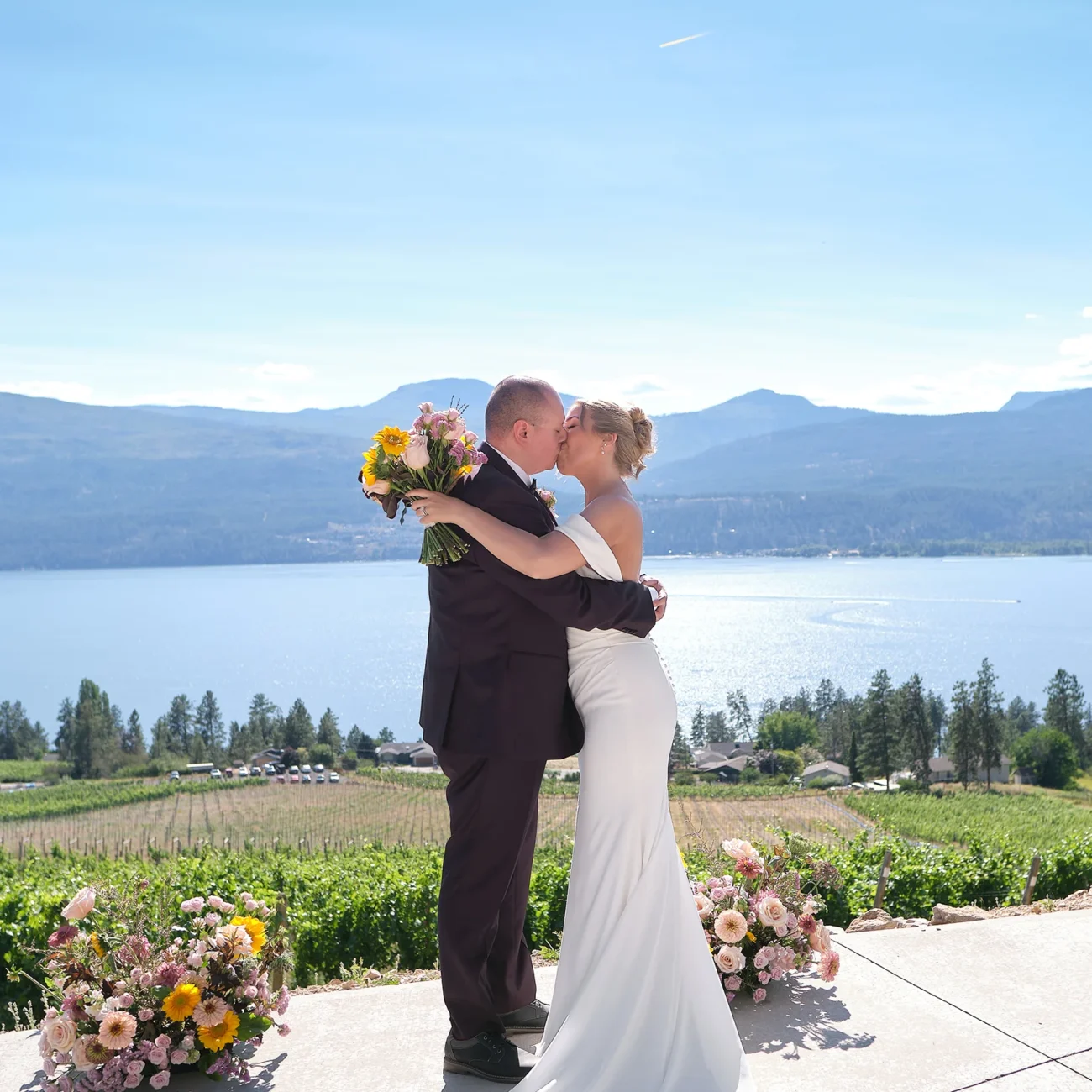 50th Parallel Estate Winery Wedding - Heather & Joshua Wedding - Bride & Groom Portraits at The Infinity Event Pad - 50th Parallel Estate Winery, Lake Country, British Columbia - July 15, 2025 - Pulse Productions Inc.